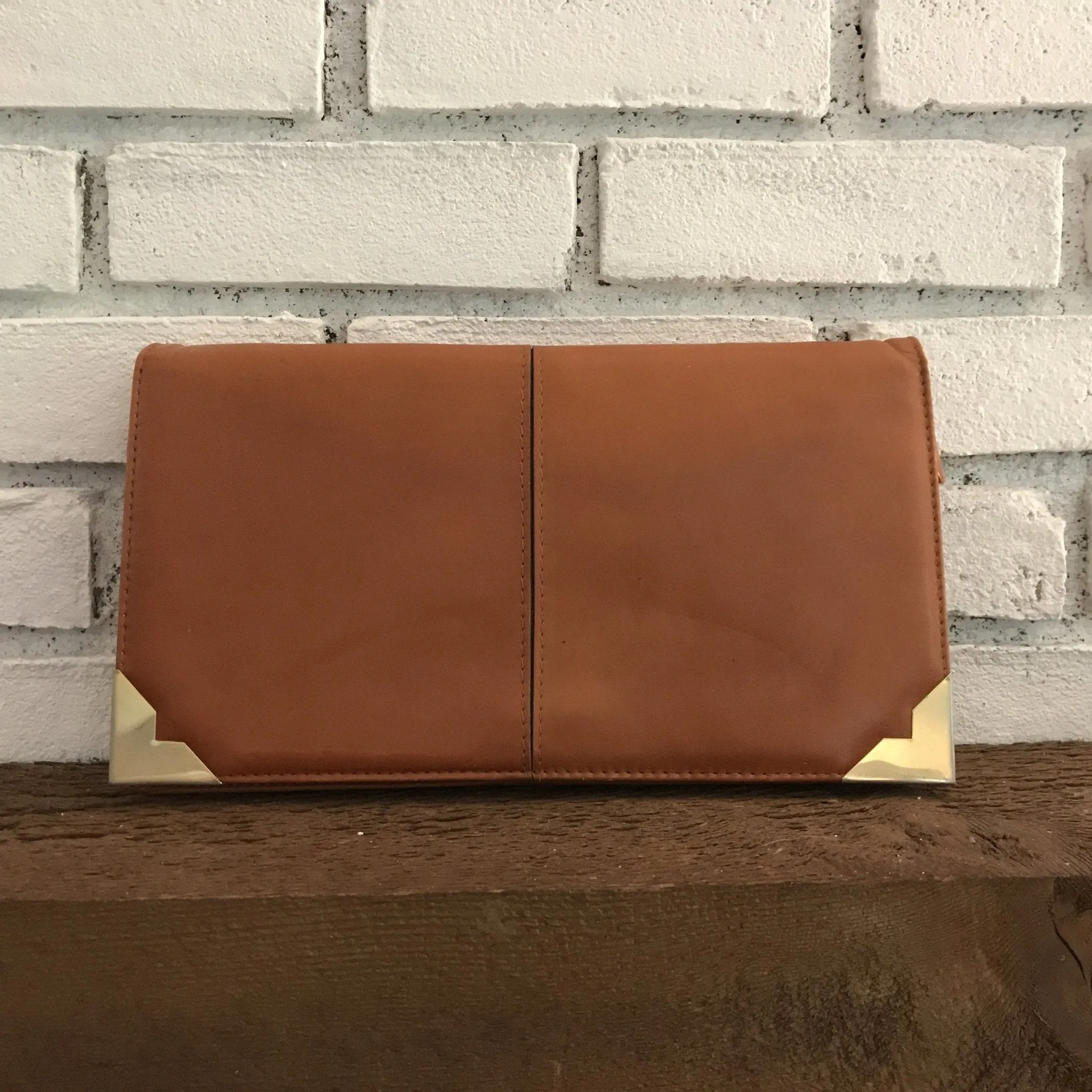 Vintage Leather Clutch from Saks Fifth Avenue Spain. Strap and Gold Accents. Circa 1970.